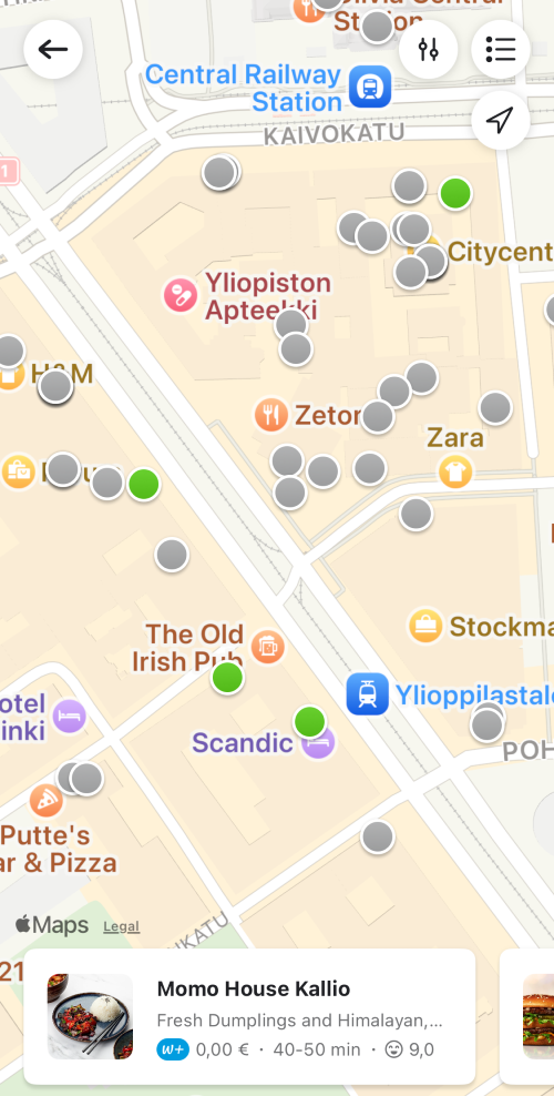 Wolt mobile app map with colored restaurant dots on it showing open or closed